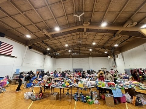 Families shopping the tables on free shopping day
